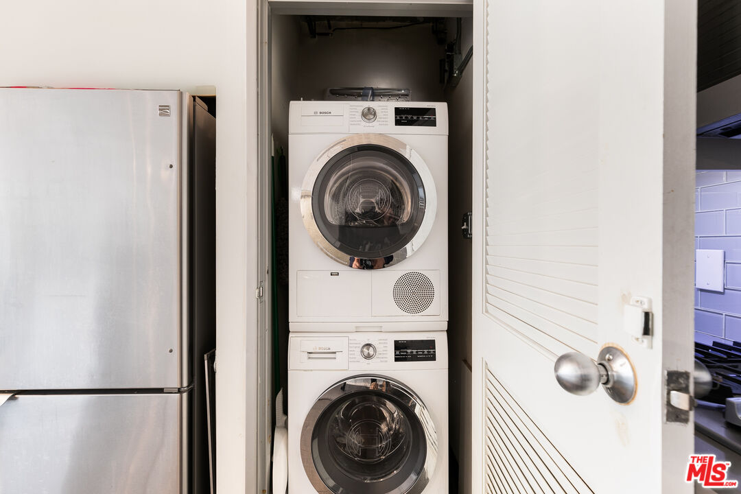 1130 Flower Street, Unit 103 Los Angeles, CA 90015 - Photo 6 of 23 a view of storage and utility room with washer and dryer