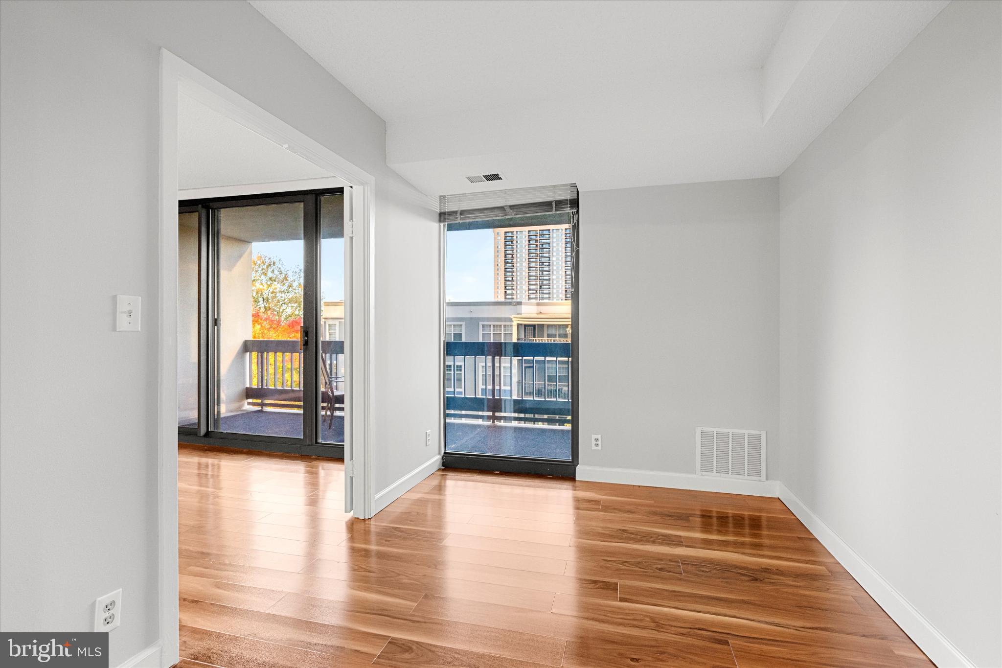 5505 Seminary Road, Unit 408N Falls Church, VA 22041 - Photo 12 of 31 a view of empty room with wooden floor and fan