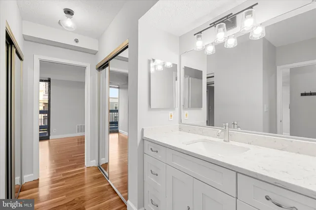 a bathroom with a double vanity sink and a mirror