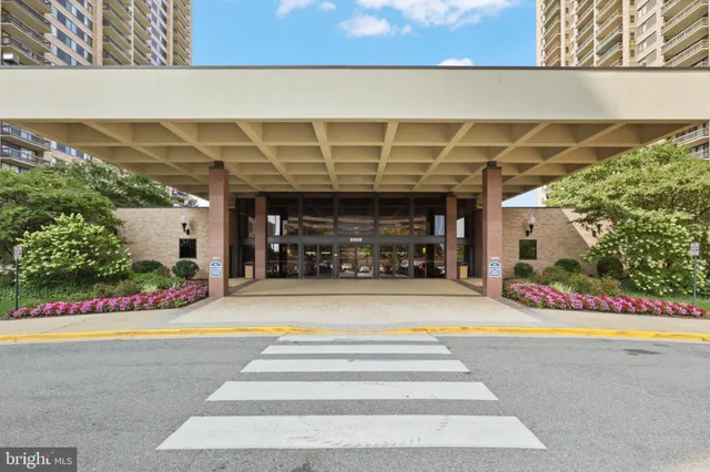 a lobby with furniture and floor to ceiling window