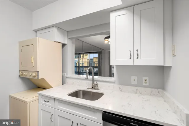 a kitchen with a sink and cabinets