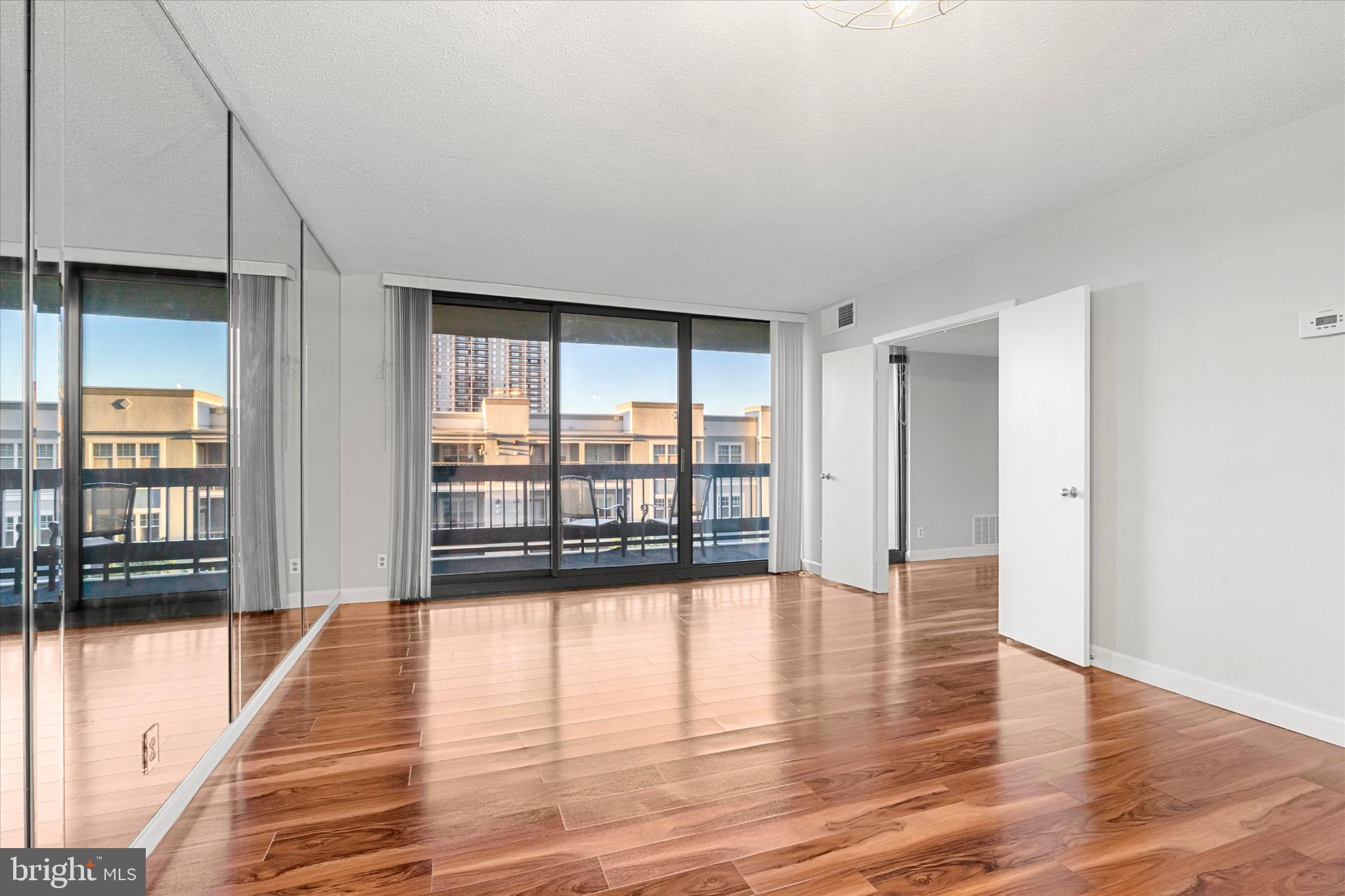 5505 Seminary Road, Unit 408N Falls Church, VA 22041 - Photo 7 of 31 a view of empty room with wooden floor and fan