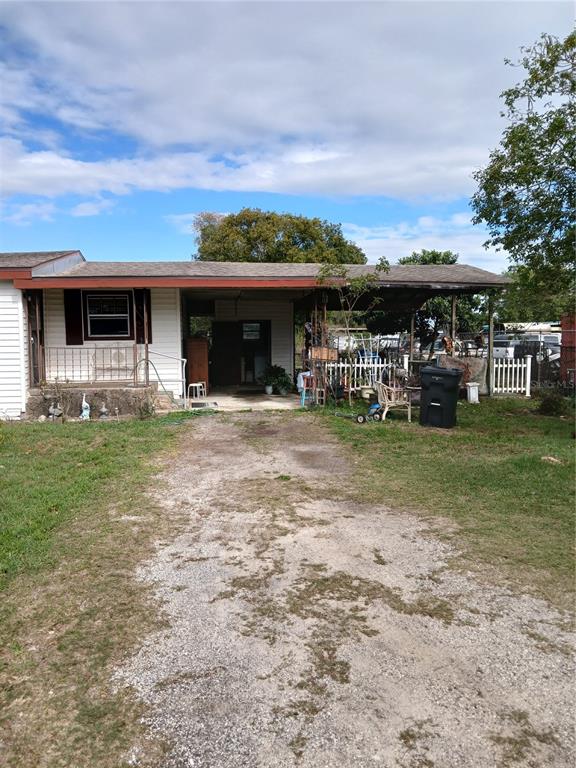 171 Melhorn Road Haines City, FL 33844 - Photo 12 of 13 a front view of a house with garden