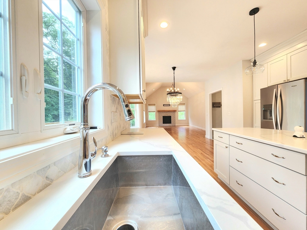 16 Exeter Road Hudson, MA 01749 - Photo 12 of 42 a large kitchen with stainless steel appliances