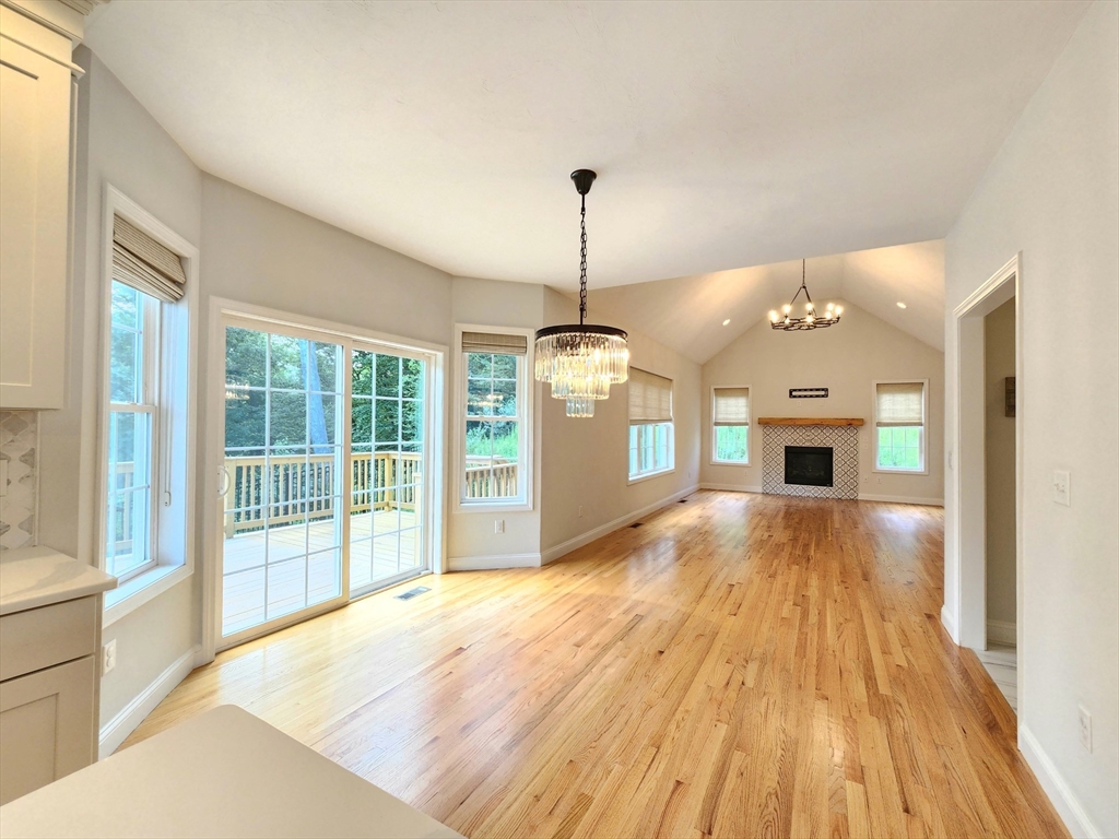 16 Exeter Road Hudson, MA 01749 - Photo 15 of 42 a view of an empty room with window and wooden floor