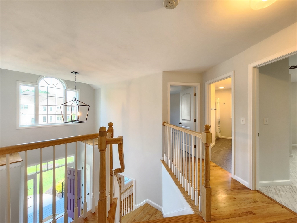 16 Exeter Road Hudson, MA 01749 - Photo 18 of 42 a view of a hallway with windows and stairs