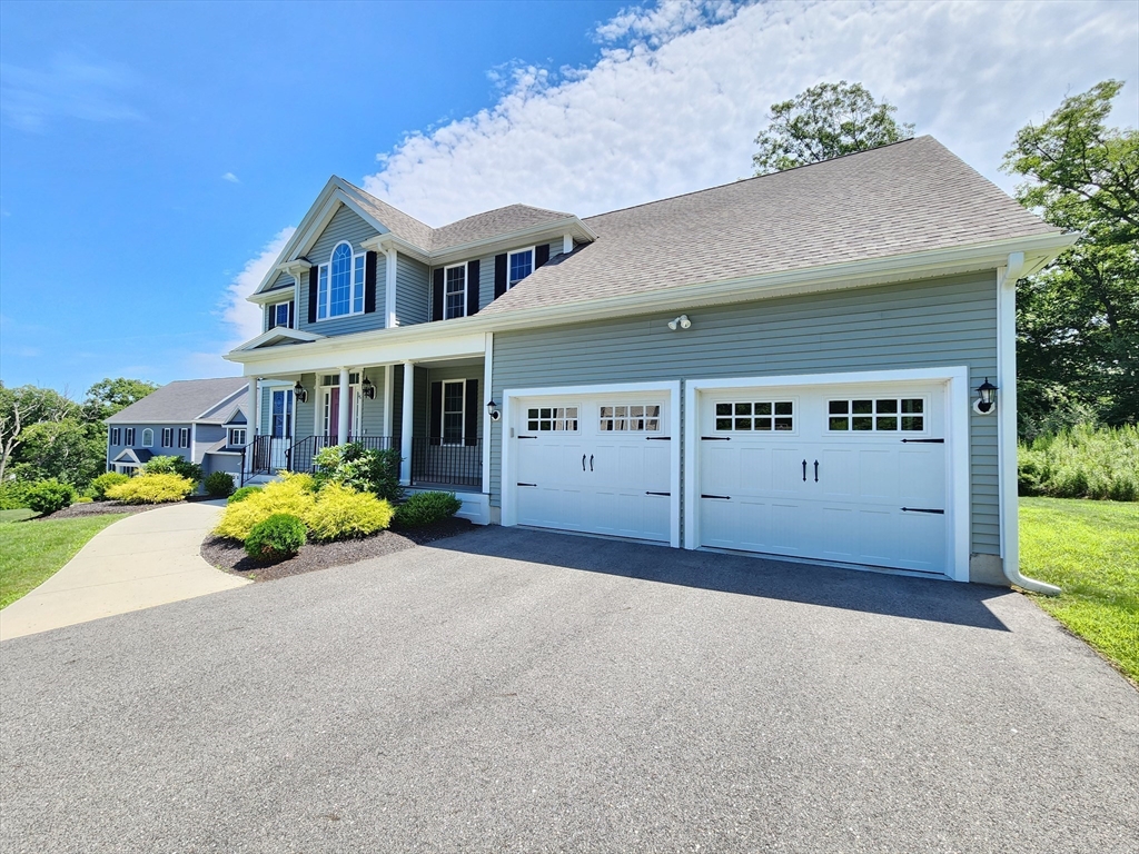 16 Exeter Road Hudson, MA 01749 - Photo 2 of 42 front view of a house with a garden