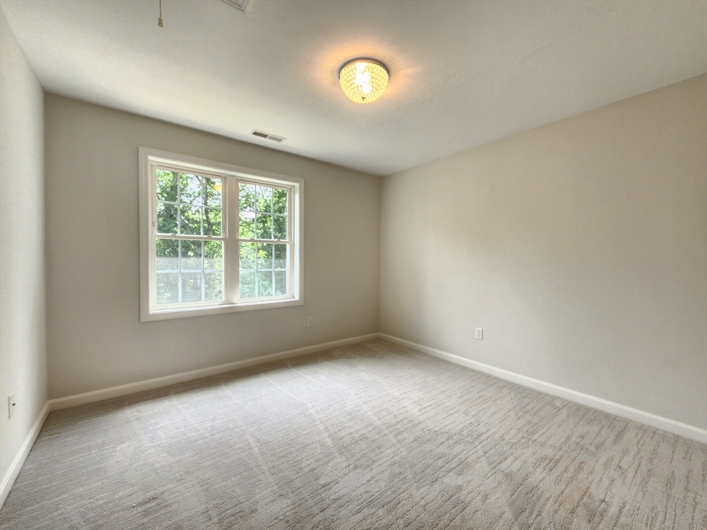 16 Exeter Road Hudson, MA 01749 - Photo 23 of 42 an empty room with windows and