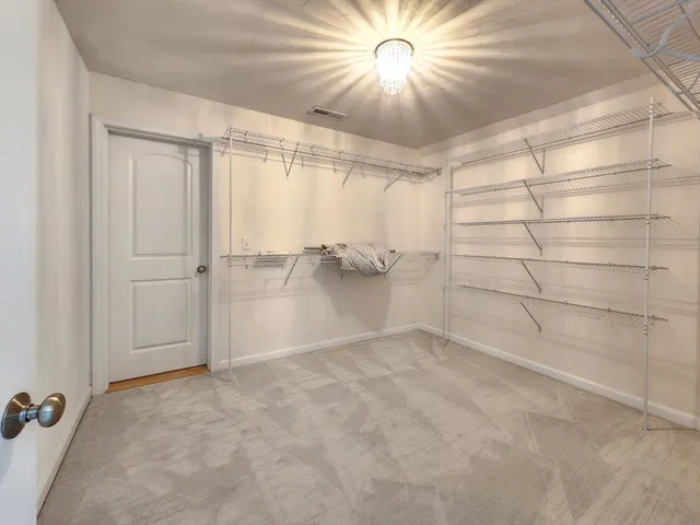 an empty room with a empty space and a ceiling fan