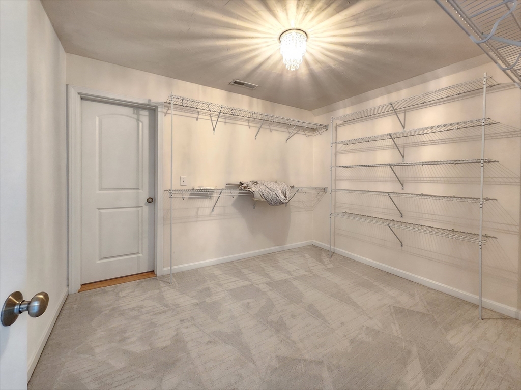 16 Exeter Road Hudson, MA 01749 - Photo 25 of 42 an empty room with a empty space and a ceiling fan