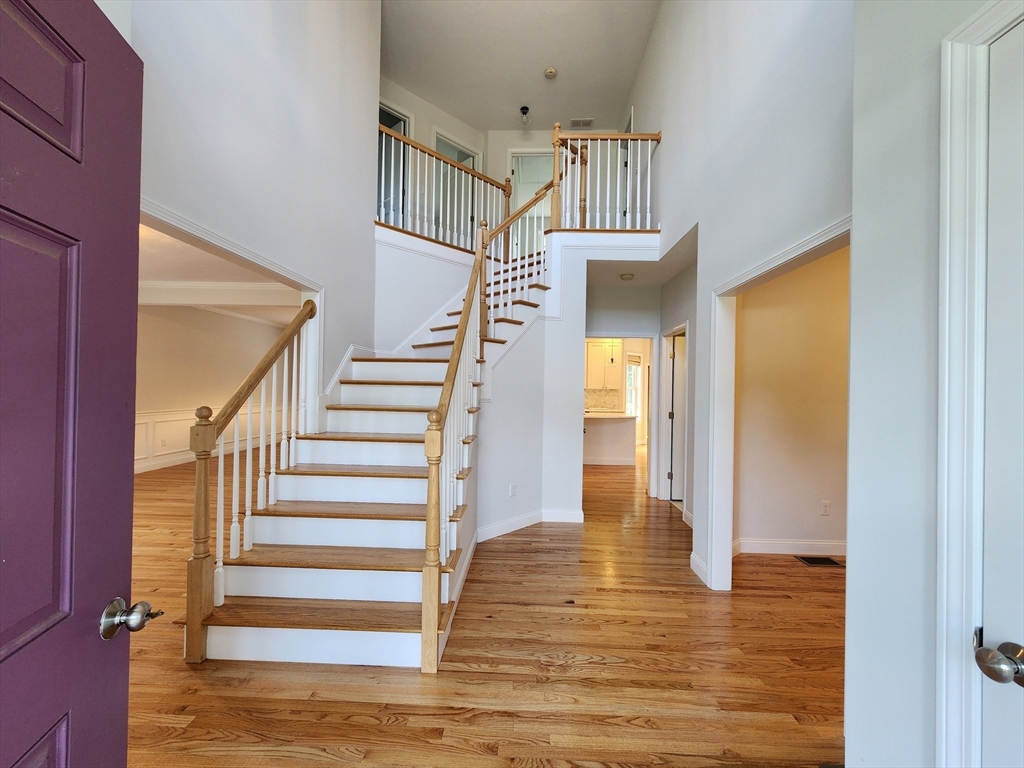 16 Exeter Road Hudson, MA 01749 - Photo 4 of 42 a view of entryway and hall with wooden floor