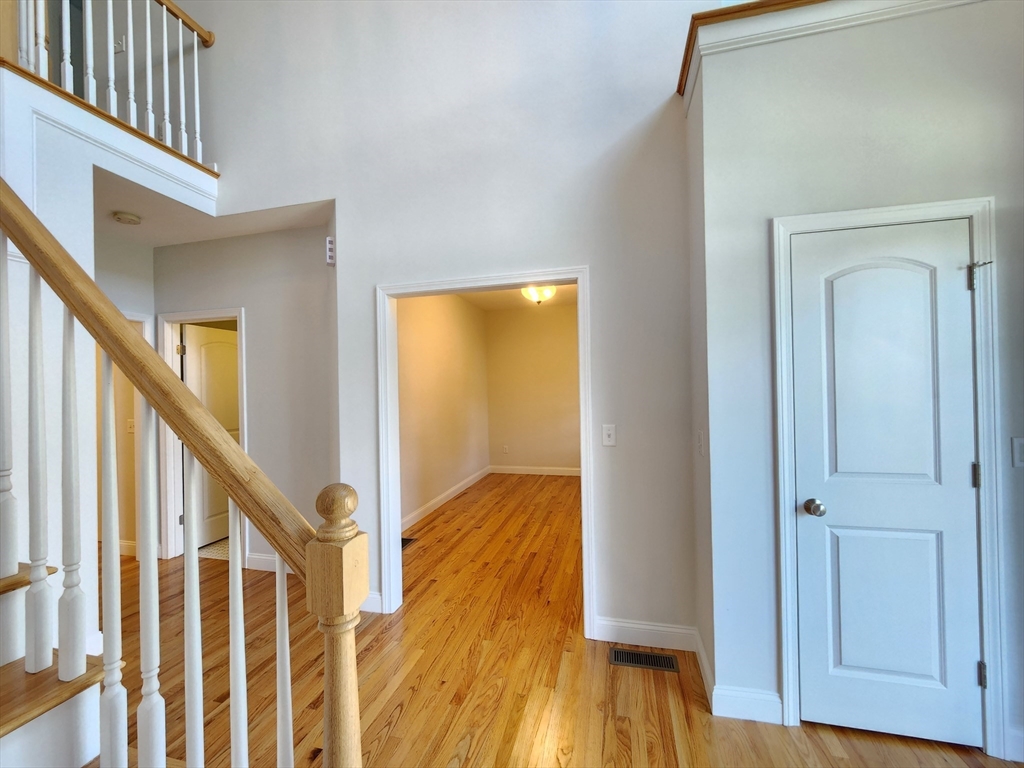 16 Exeter Road Hudson, MA 01749 - Photo 6 of 42 a view of staircase with wooden floor and staircase