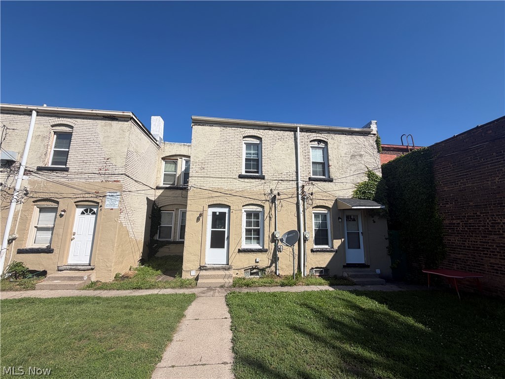 15416 Waterloo Road Cleveland, OH 44110 - Photo 16 of 18 Two-story brick exterior with multiple entry points