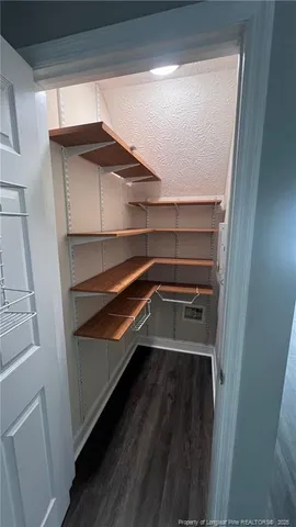 a storage room with wooden floor