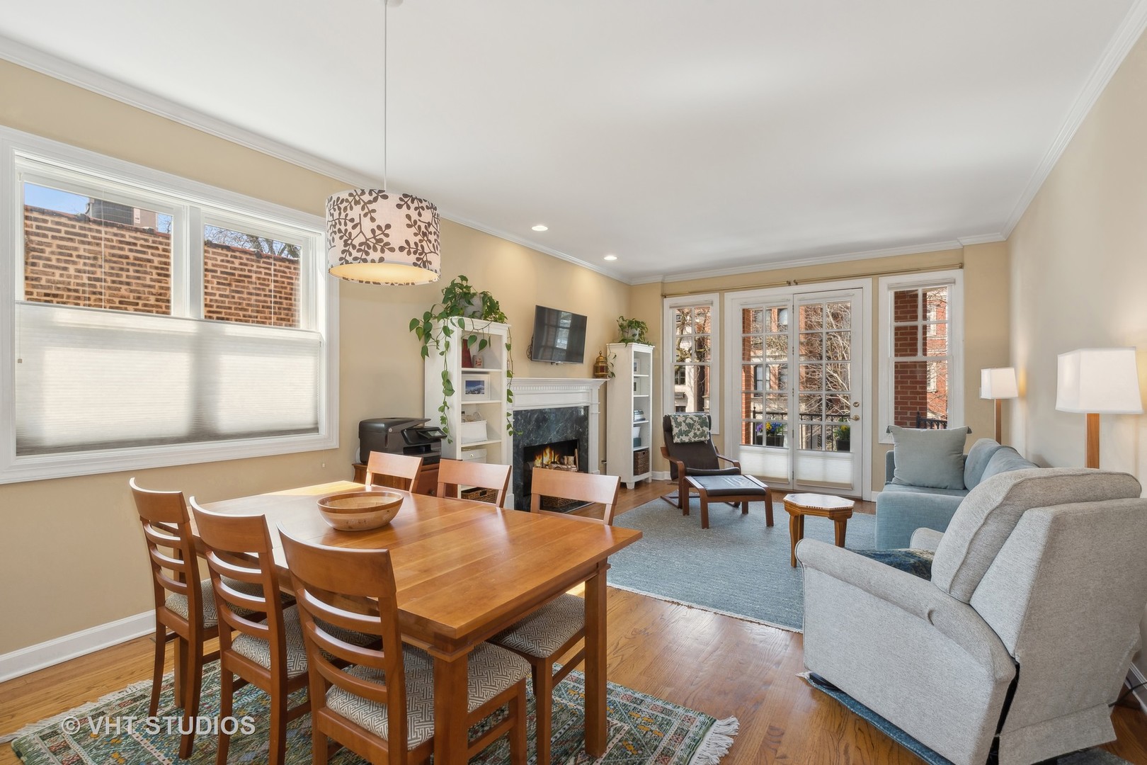1725 North Mohawk Street, Unit 2S Chicago, IL 60614 - Photo 6 of 15 a living room with furniture a fireplace and large windows
