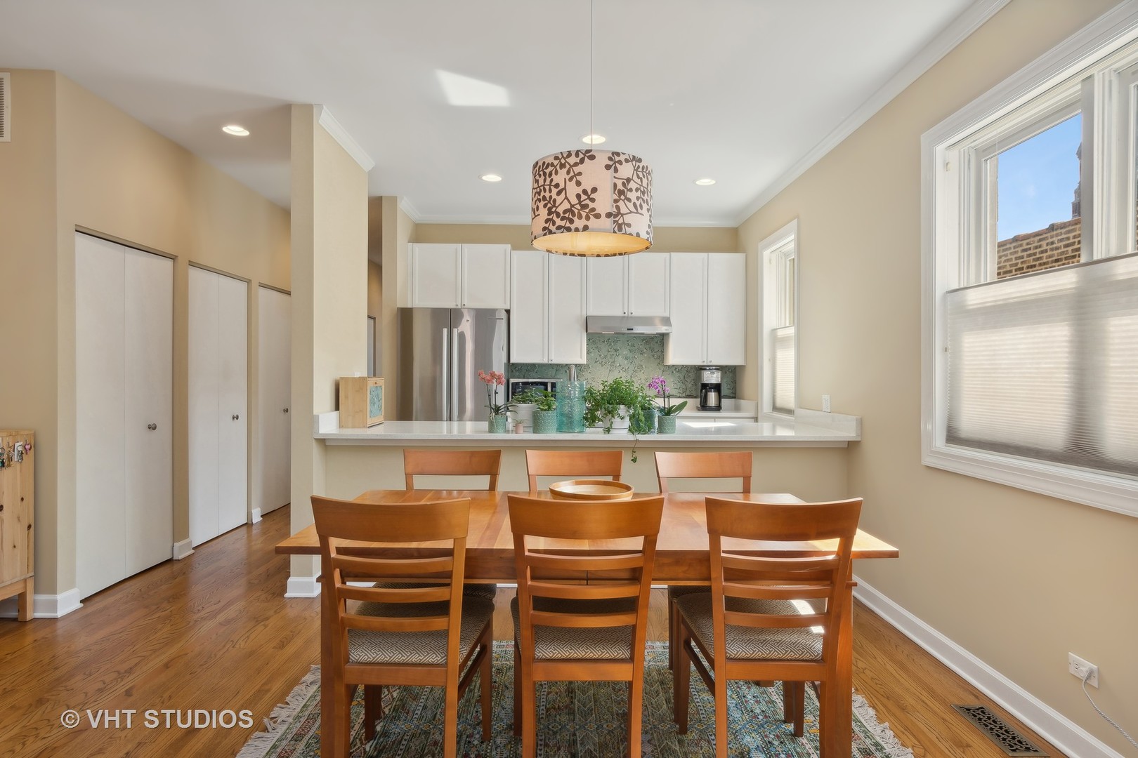 1725 North Mohawk Street, Unit 2S Chicago, IL 60614 - Photo 7 of 15 a dining room with furniture and wooden floor