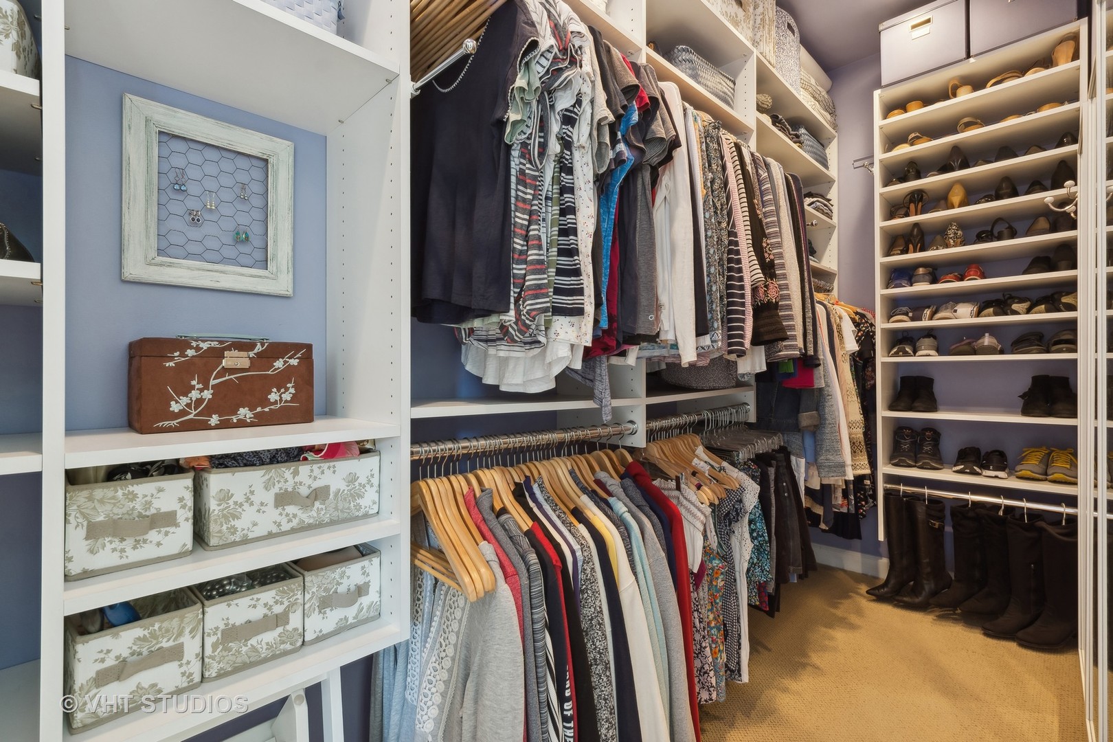 1725 North Mohawk Street, Unit 2S Chicago, IL 60614 - Photo 10 of 15 a view of walk in closet with clothes and shoes