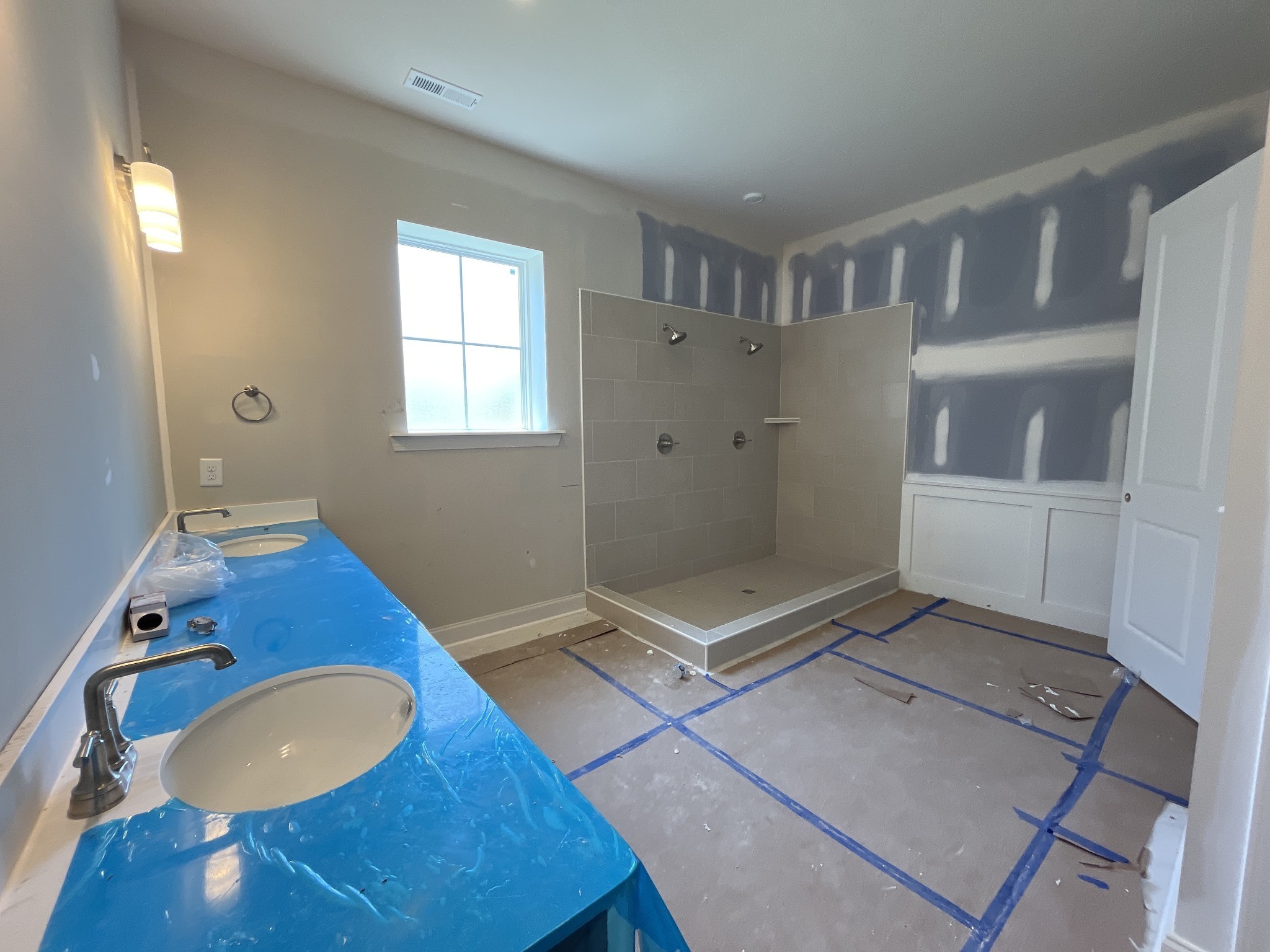 7509 Shoal Mill Point Fairview, TN 37062 - Photo 12 of 29 a bathroom with a granite countertop sink toilet and shower