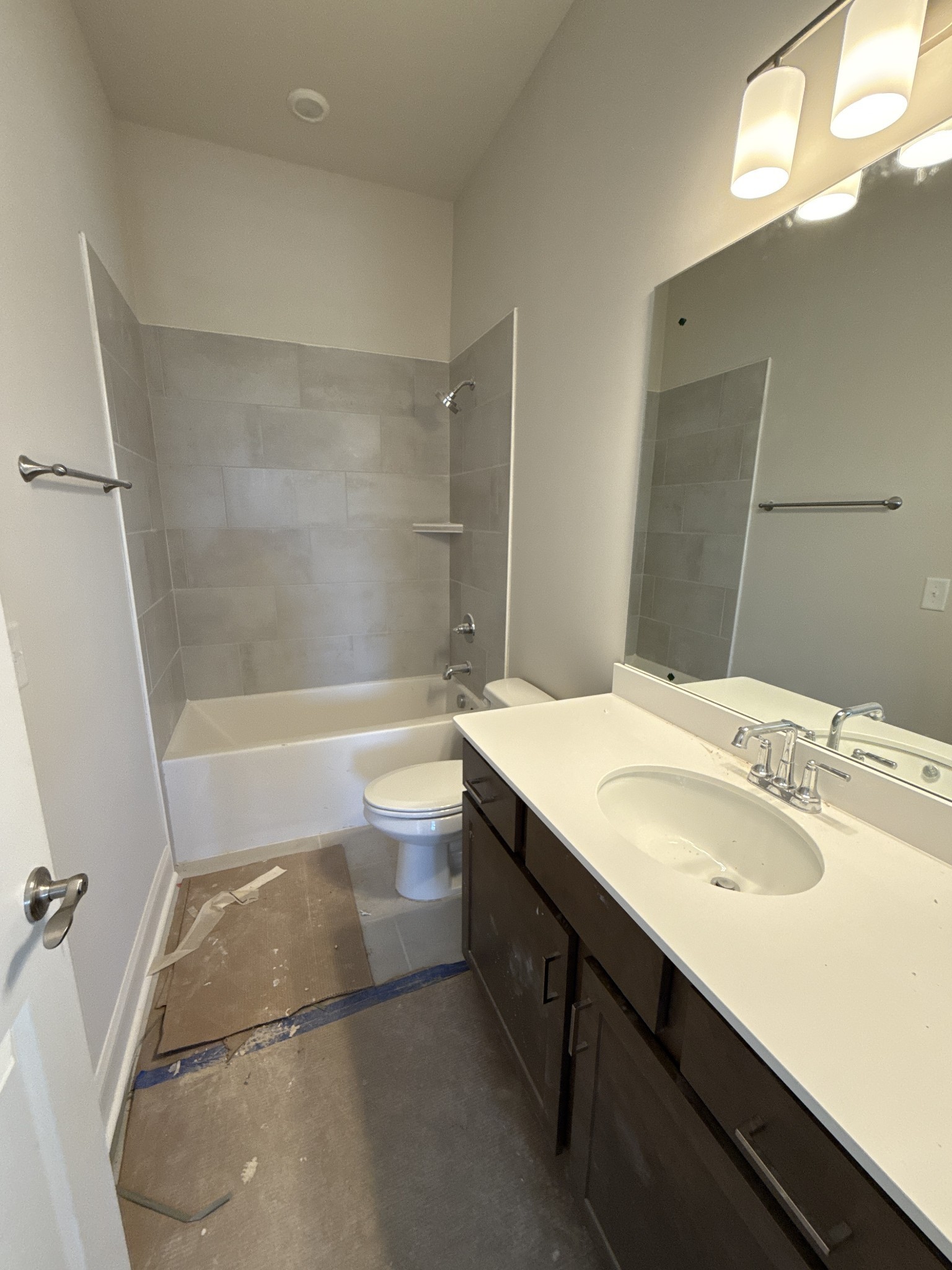 7509 Shoal Mill Point Fairview, TN 37062 - Photo 22 of 29 a bathroom with a sink a toilet a mirror and bathtub