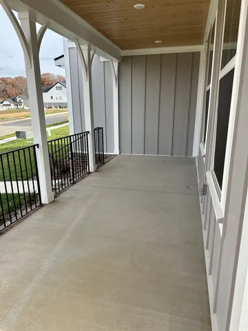 a bathroom with a glass door shower and a mirror