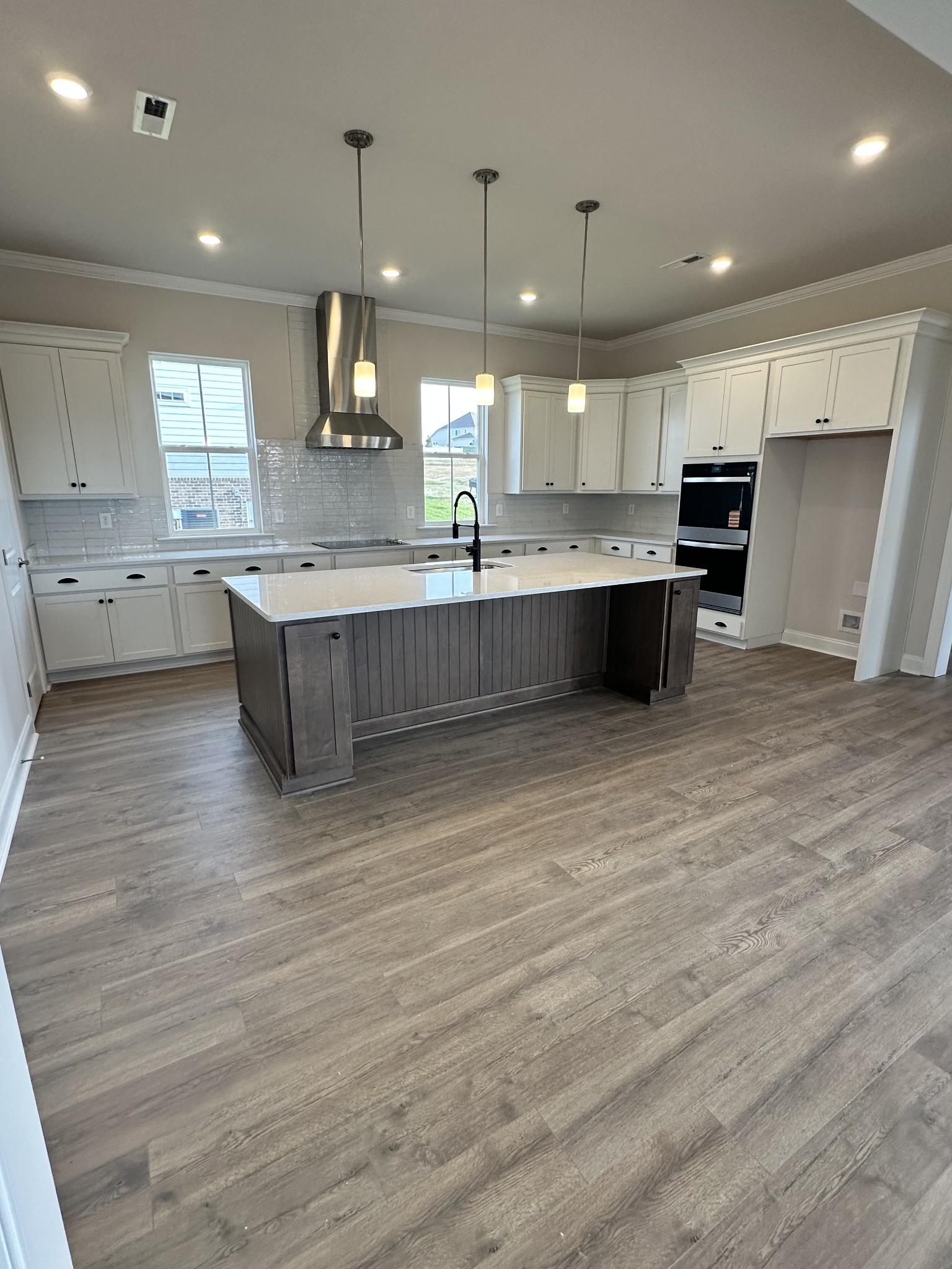 7509 Shoal Mill Point Fairview, TN 37062 - Photo 28 of 29 a large kitchen with kitchen island a sink stainless steel appliances and cabinets