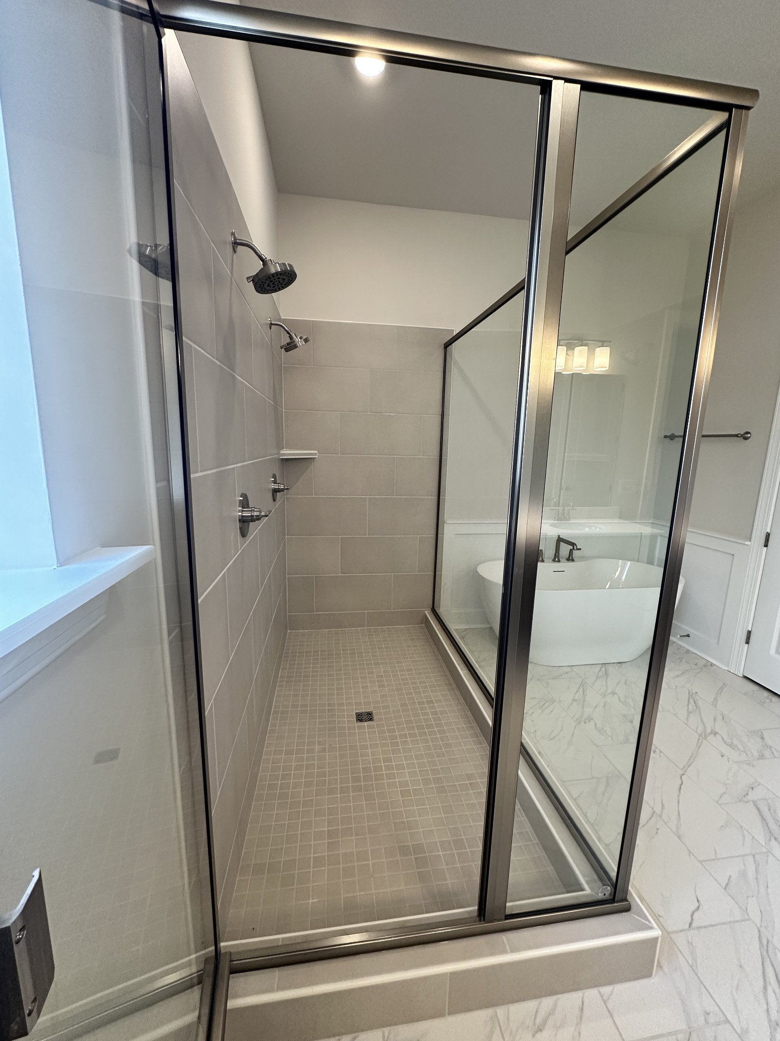 7509 Shoal Mill Point Fairview, TN 37062 - Photo 29 of 29 a bathroom with a glass door shower and a mirror