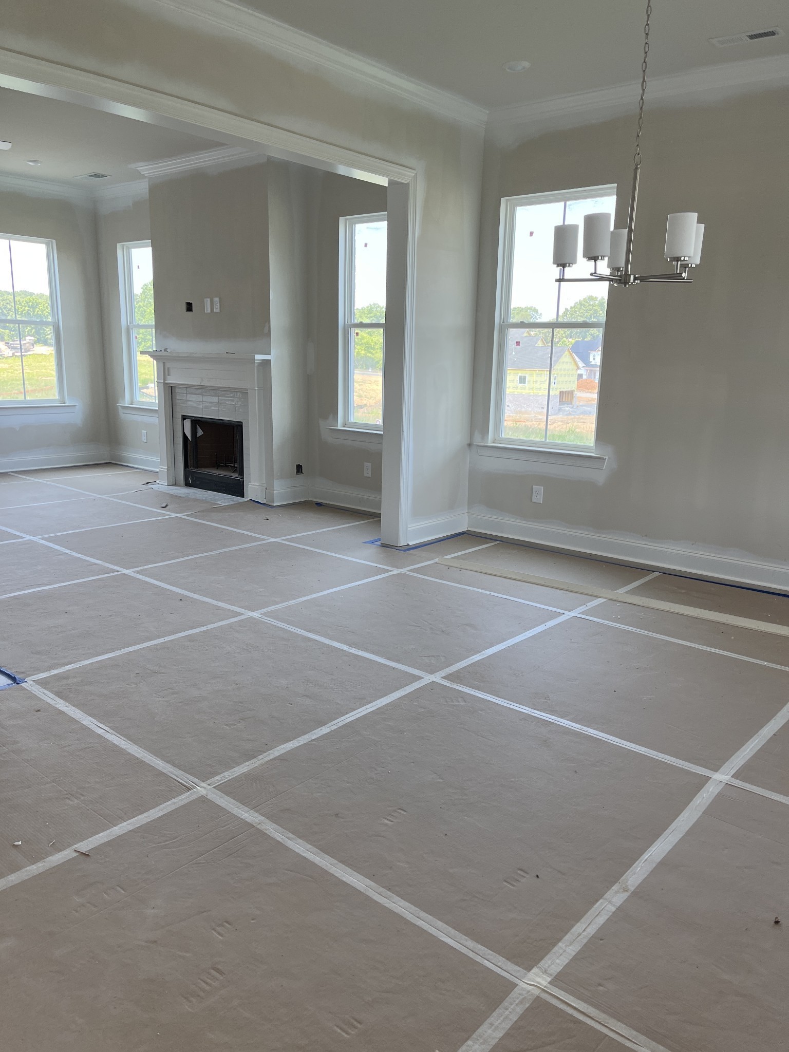 7509 Shoal Mill Point Fairview, TN 37062 - Photo 8 of 29 a view of an empty room with a fireplace and a window