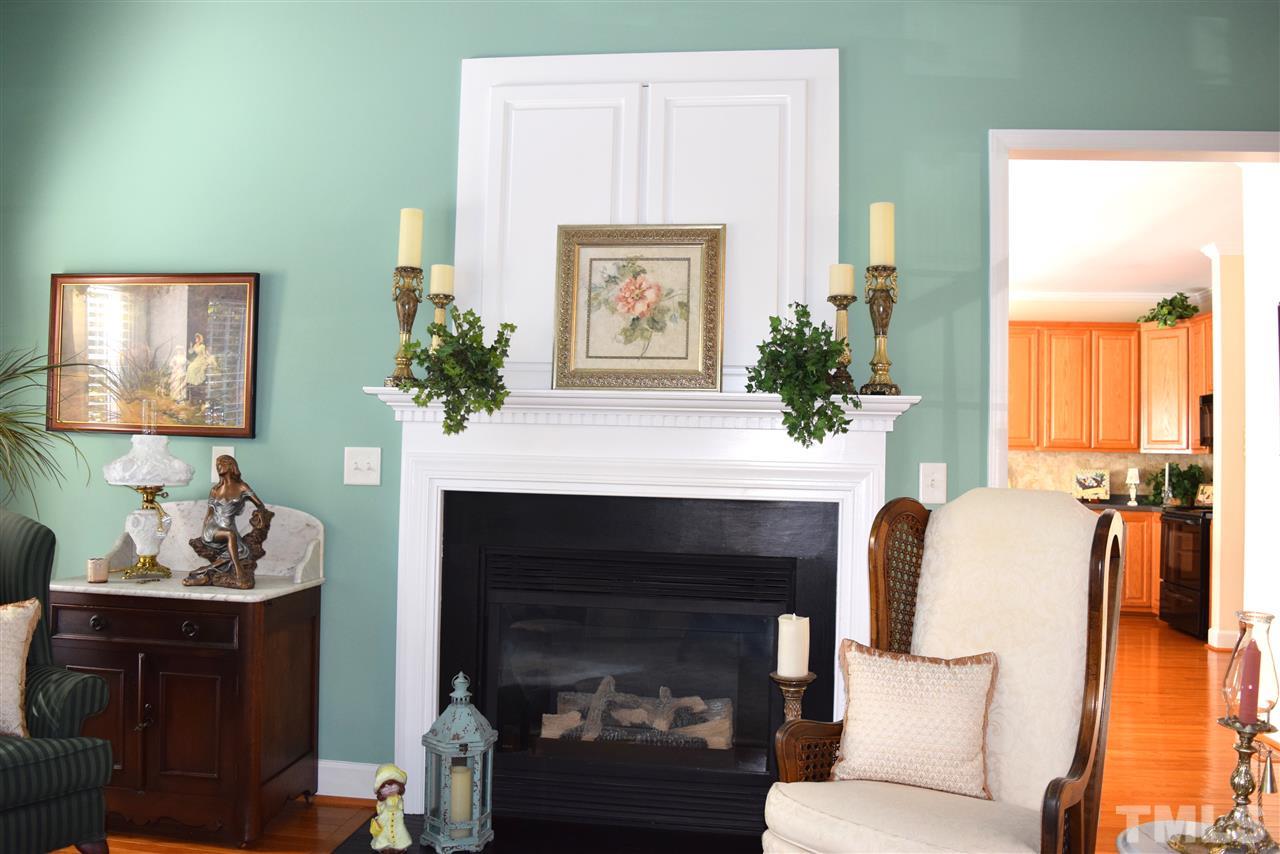 620 Middle Bridge Road Wake Forest, NC 27587 - Photo 13 of 25 This shot shows the fireplace with gas logs. There is a TV niche over the mantel that is not being used