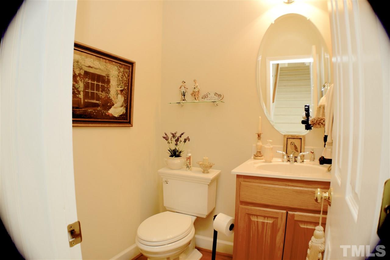 620 Middle Bridge Road Wake Forest, NC 27587 - Photo 17 of 25 Wide angle lens distorts picture shape but the 1/2 bath/power room has a pedestal sink and new water saver toilet that is chair height.