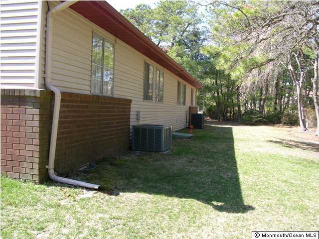 35A Sunset Road, Unit B Whiting, NJ 08759 - Photo 3 of 3 a backyard of a house with lots of green space