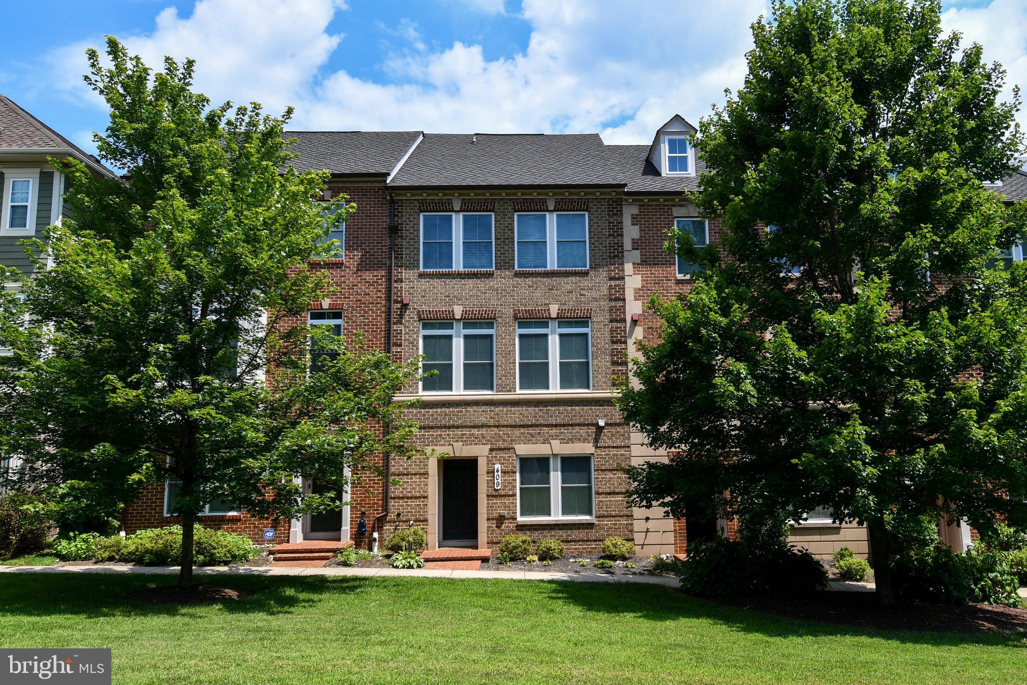 409 Hydrangea Place Gaithersburg, MD 20878 - Photo 1 of 49 front view of a building with a yard