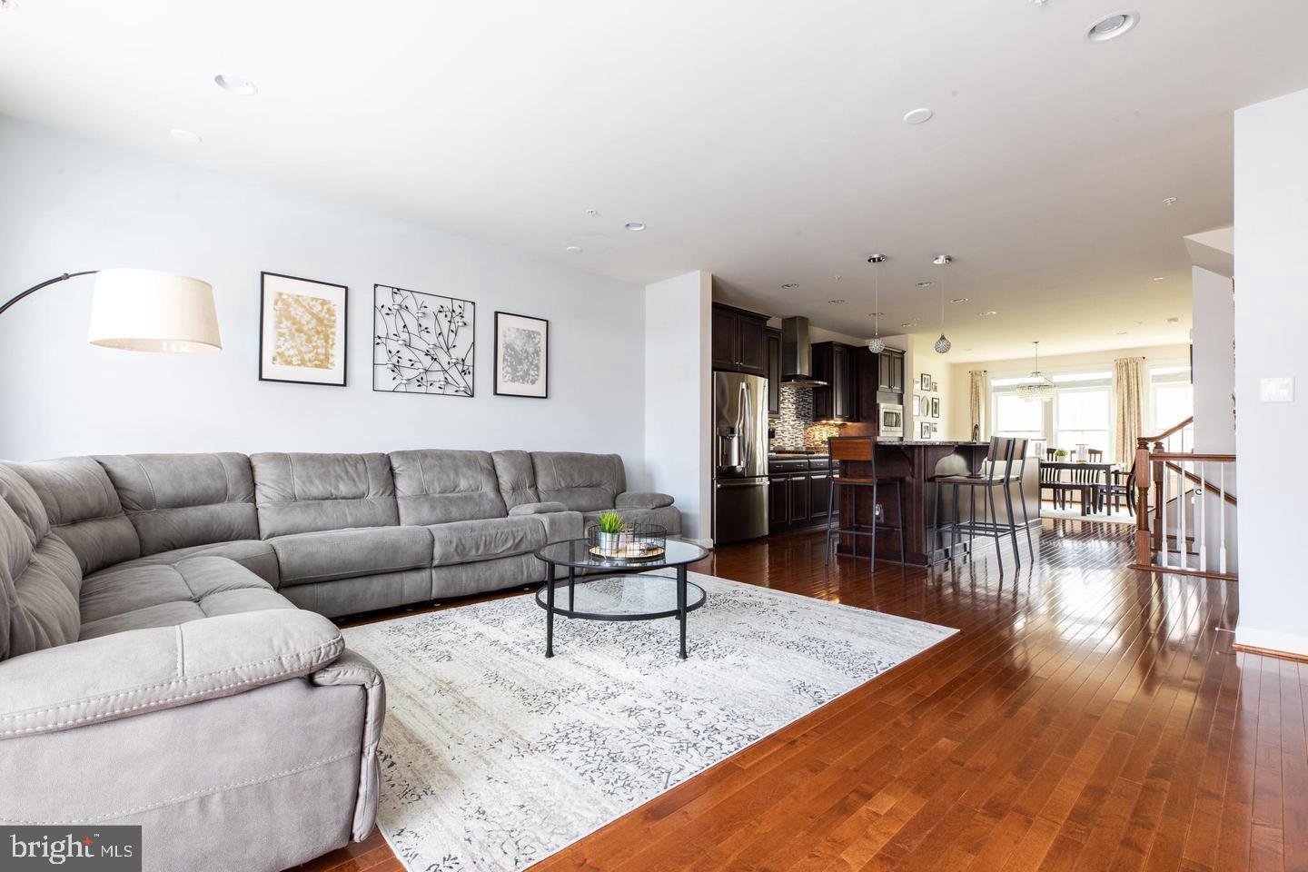 409 Hydrangea Place Gaithersburg, MD 20878 - Photo 12 of 49 a living room with furniture and wooden floor