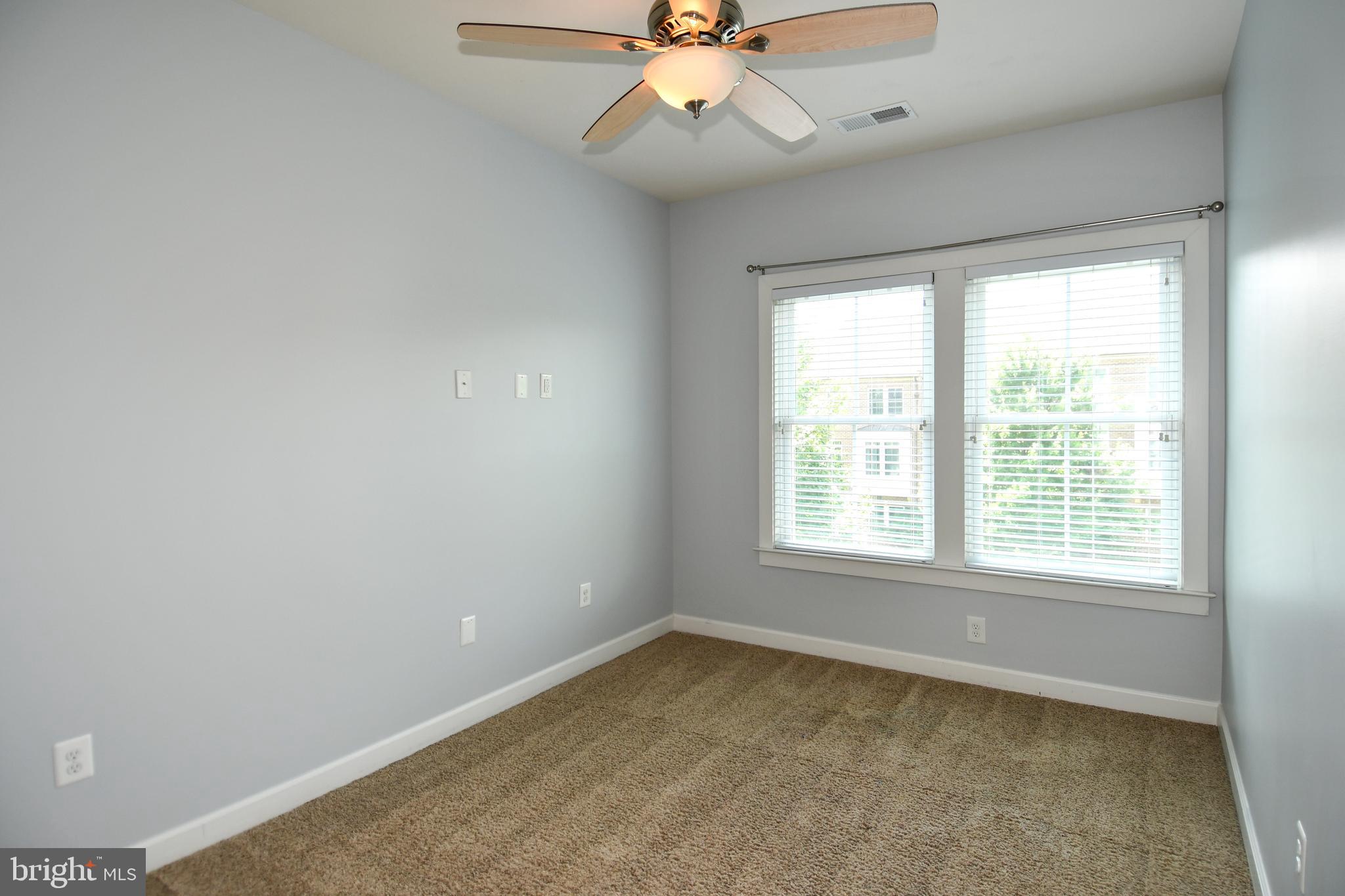 409 Hydrangea Place Gaithersburg, MD 20878 - Photo 32 of 49 a view of an empty room with a window