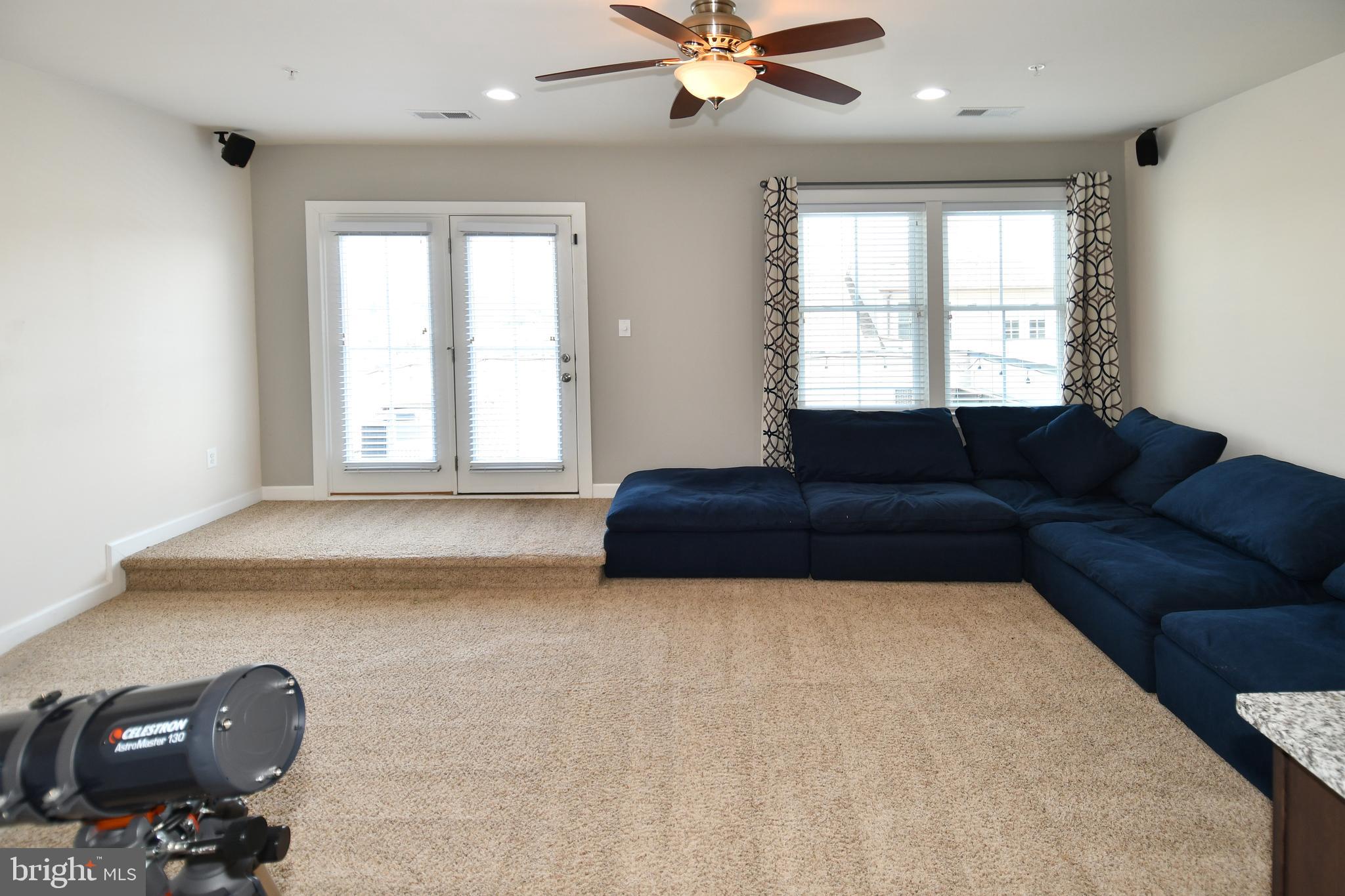 409 Hydrangea Place Gaithersburg, MD 20878 - Photo 37 of 49 a living room with furniture and a window
