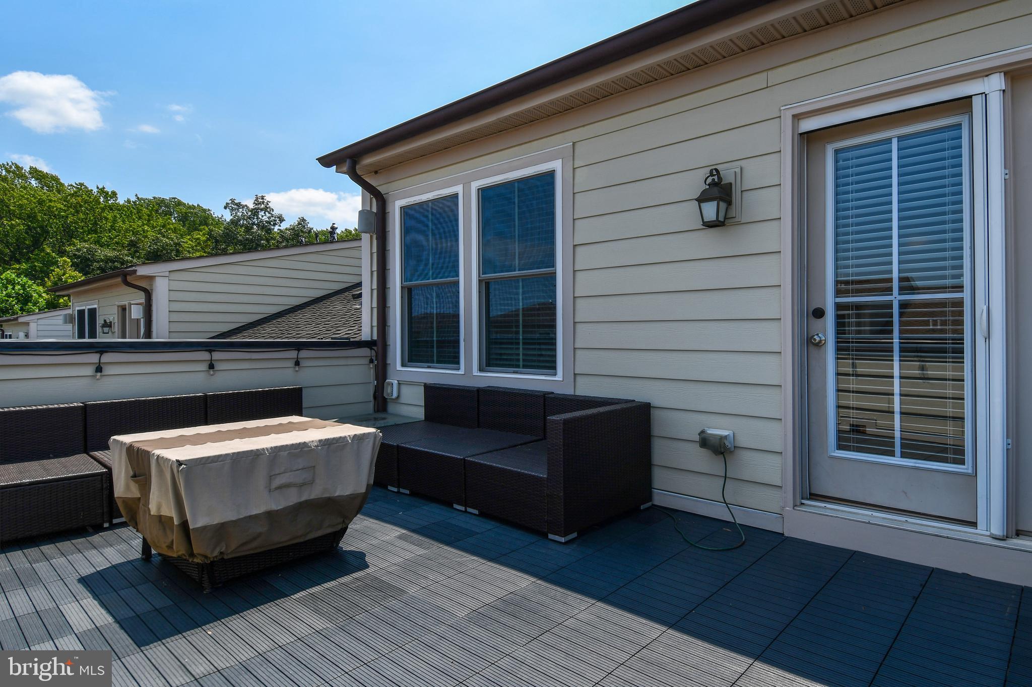 409 Hydrangea Place Gaithersburg, MD 20878 - Photo 43 of 49 a view of a roof deck with wooden floor and fence