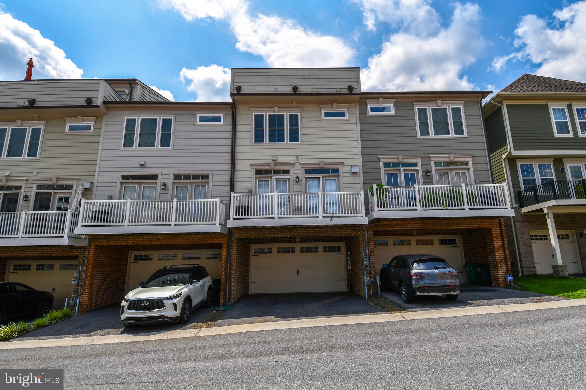 409 Hydrangea Place Gaithersburg, MD 20878 - Photo 44 of 49 a car parked in front of a building