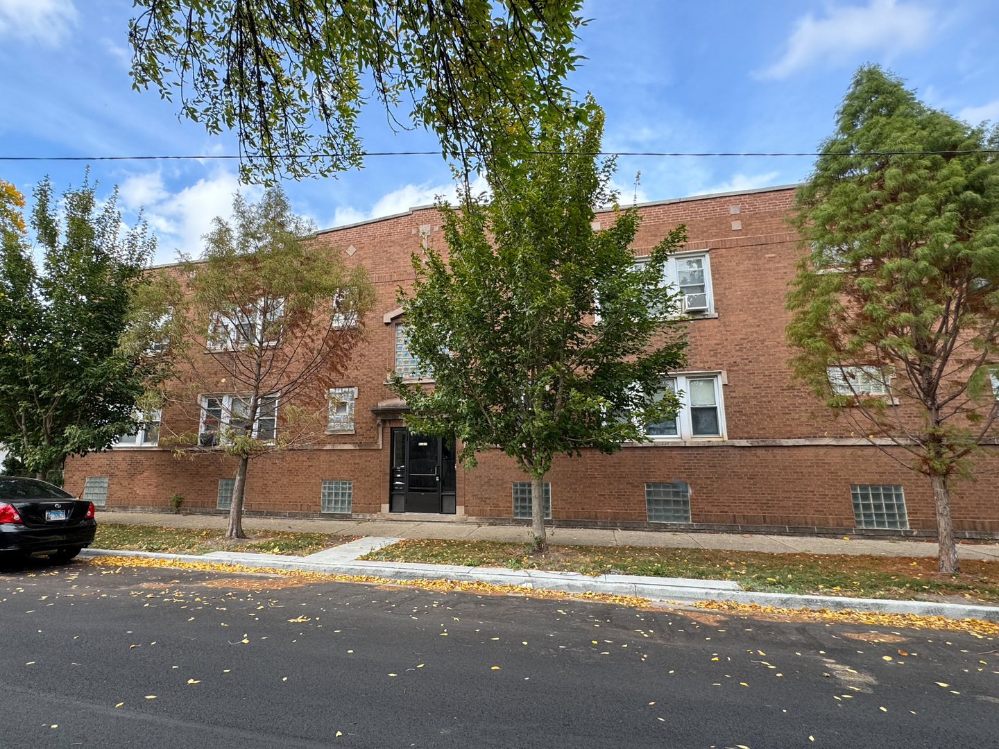 5904 West Berteau Avenue, Unit 2W Chicago, IL 60634 - Photo 1 of 1 a view of street with parked cars