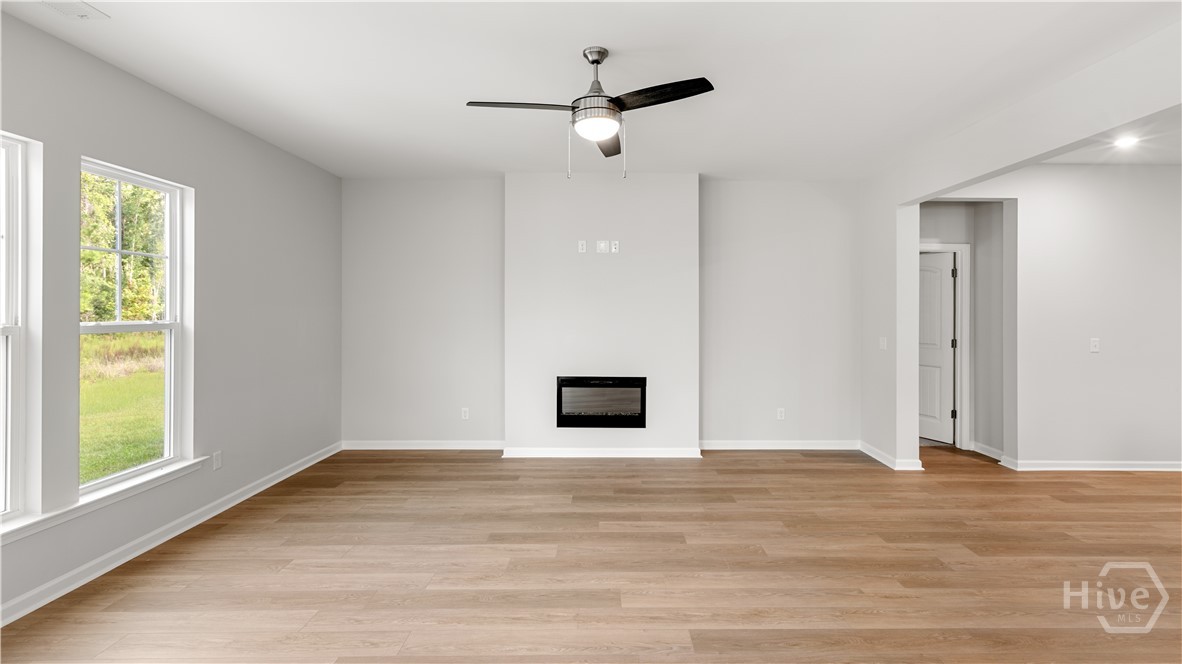 146 Como Drive Pooler, GA 31322 - Photo 6 of 23 Living area with Electric Fireplace