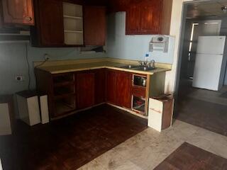 3224 Baylor Street Lubbock, TX 79415 - Photo 11 of 23 a kitchen with a sink and cabinets