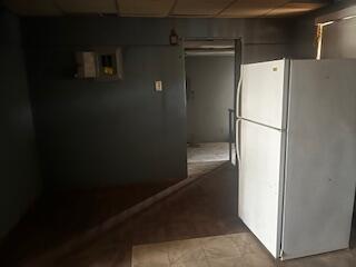3224 Baylor Street Lubbock, TX 79415 - Photo 12 of 23 a white refrigerator freezer and a stove sitting inside of a kitchen