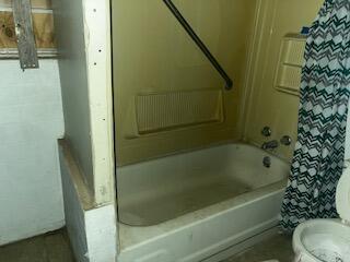 3224 Baylor Street Lubbock, TX 79415 - Photo 14 of 23 a bathroom with a bathtub and shower