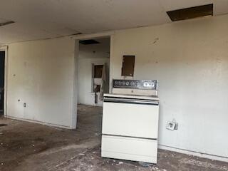 3224 Baylor Street Lubbock, TX 79415 - Photo 20 of 23 a kitchen with a stove and a refrigerator