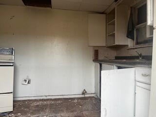 3224 Baylor Street Lubbock, TX 79415 - Photo 21 of 23 a kitchen with a sink and cabinets