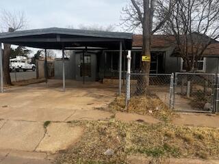 3224 Baylor Street Lubbock, TX 79415 - Photo 22 of 23 a backyard of a house with table and chairs
