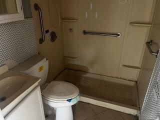 3224 Baylor Street Lubbock, TX 79415 - Photo 8 of 23 a bathroom with a toilet and a shower