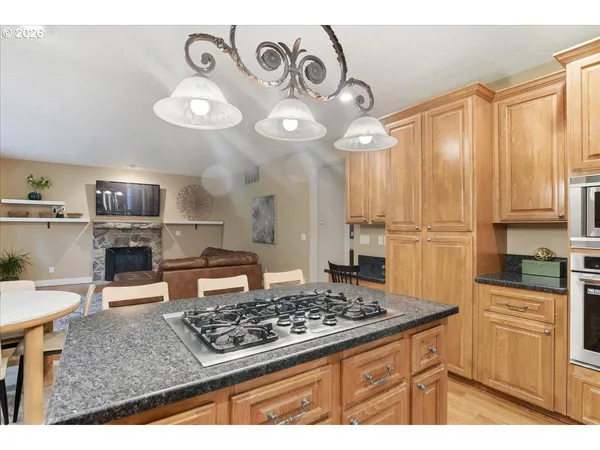 a kitchen with a stove and a refrigerator