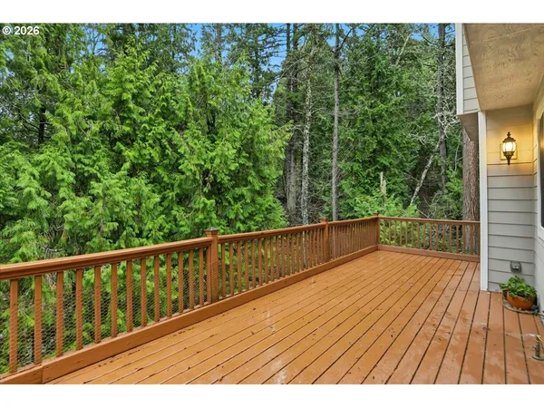 a view of balcony with wooden floor