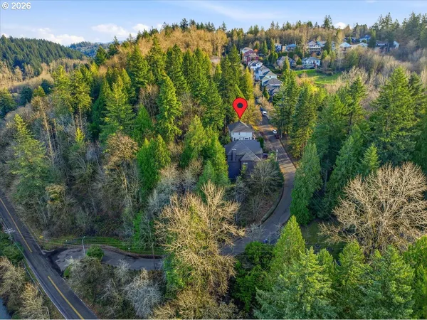 a view of a lake with a house in the background
