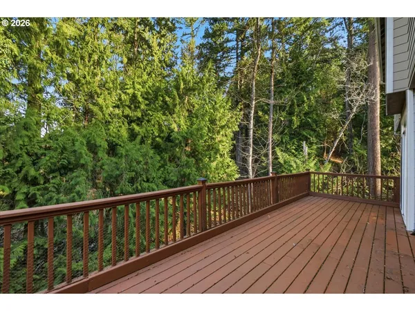 a view of balcony with wooden floor