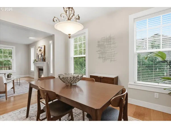 a view of a dining room with furniture and windows